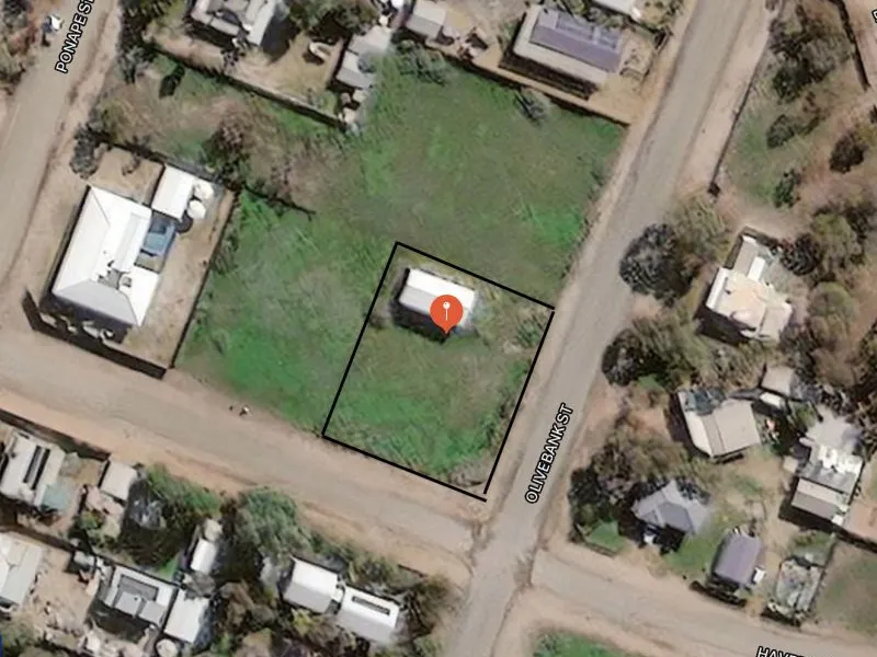 Flat corner block of land with large shed