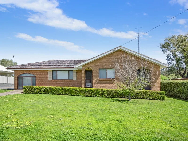 COMFORTABLE HOME w. LARGE SHEDS & HARDSTAND PARKING
