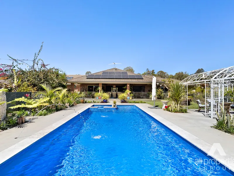 Every suburb is blessed with a hidden gem, a property that screams WOW factor. In Tamborine - this is it!