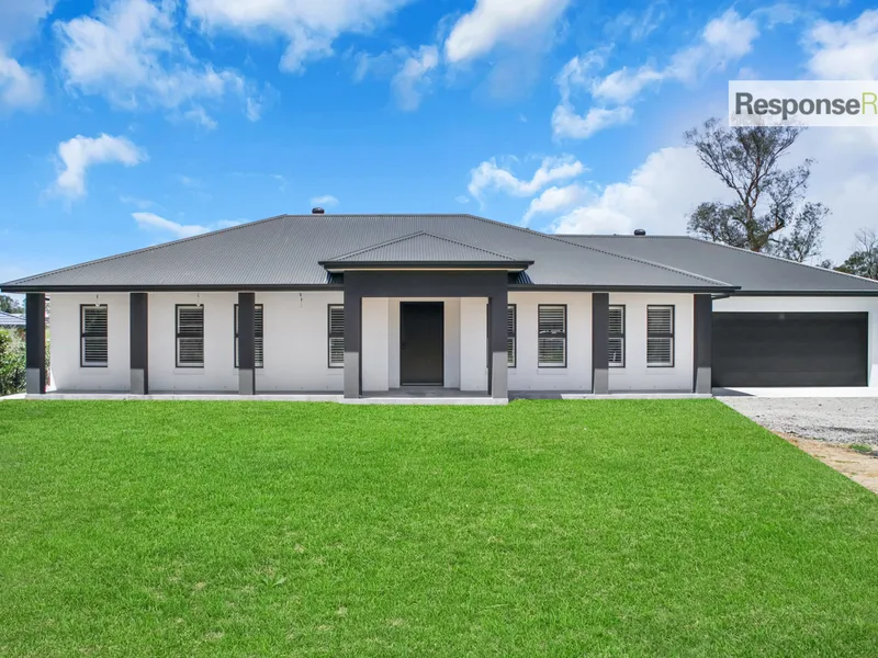 LUXURIOUS BRAND-NEW HOME WITH ACREAGE!