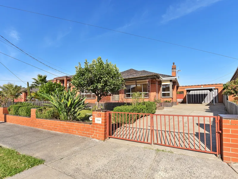 A DECIEVINGLY SPACIOUS BRICK VENEER HOME