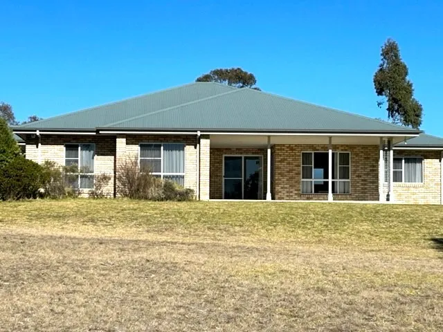 BEAUTIFULLY PRESENTED BRICK HOME ON 11 ACRES
