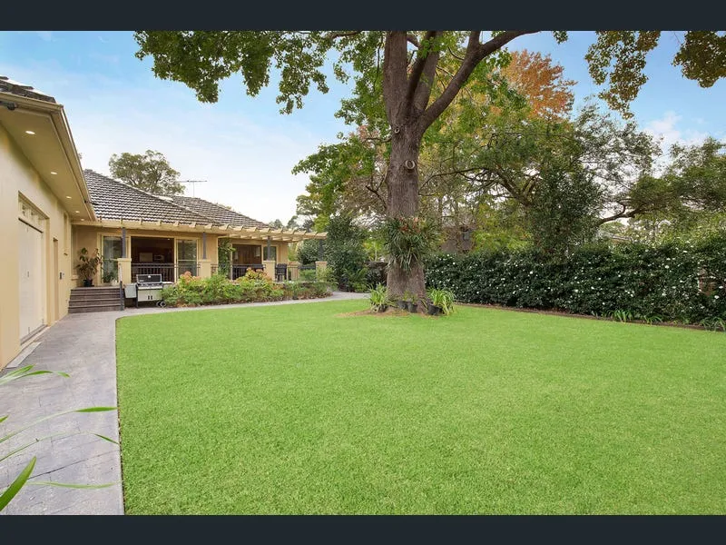 Beautiful full brick home with pristine gardens