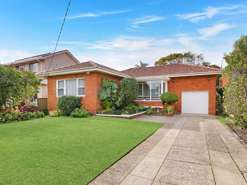 Single level home with potential in blue ribbon locale