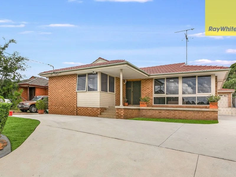 HIGH SET BRICK HOME IN PREMIER LOCATION