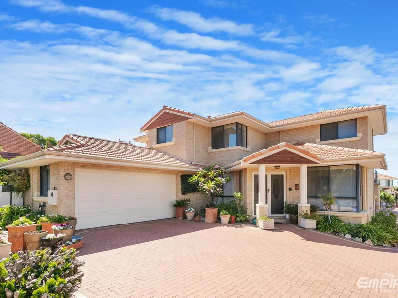 Sprawling Family Residence with River Views & Easy Care Appeal!