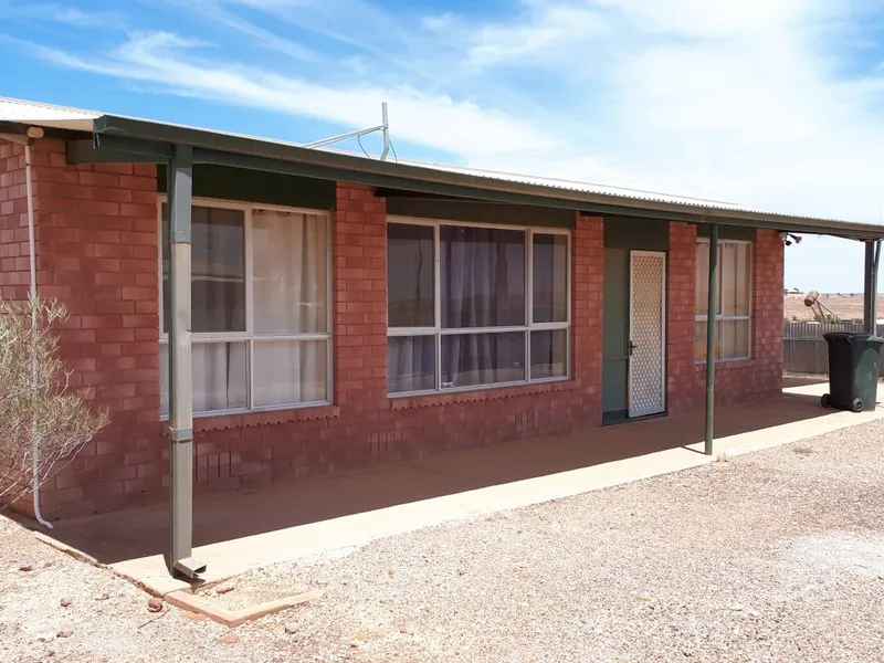 FULLY FENCED 2 BEDROOM HOME WITH CARPORT