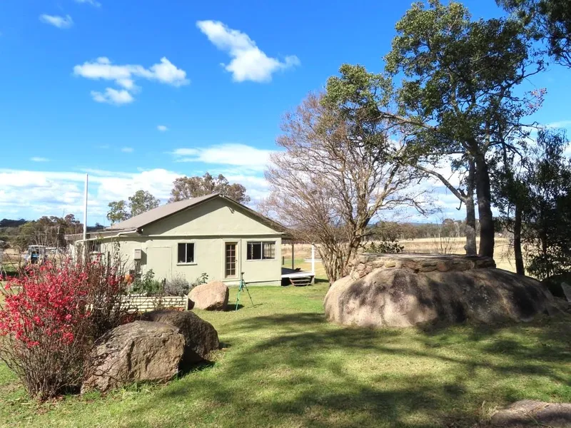 HOME ON 70 GLORIOUS ACRES