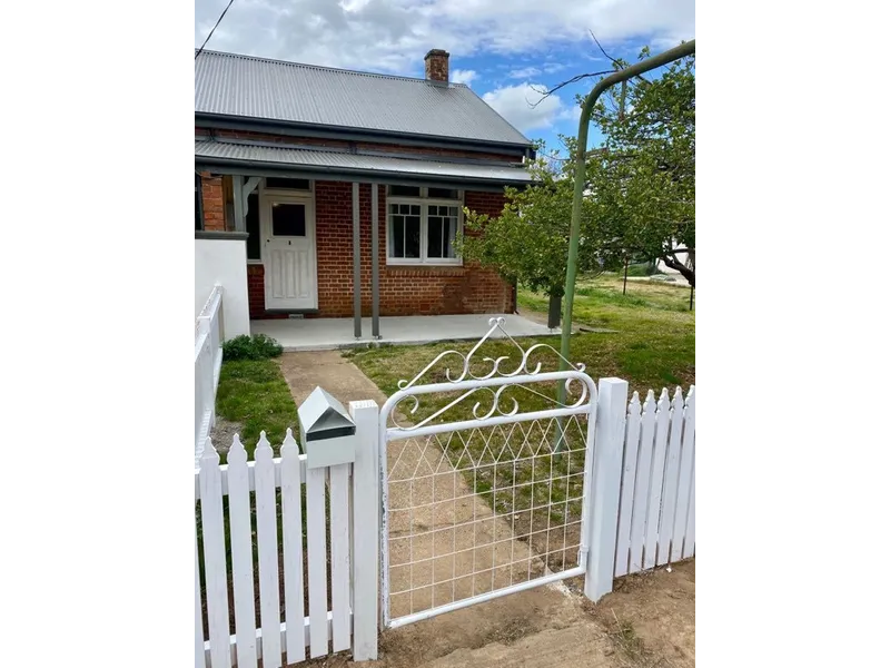 CHARMING TWO BEDROOM UNIT.