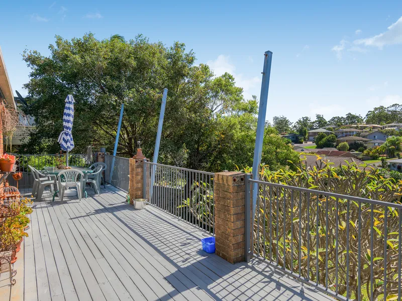 Charming Split-Level Brick Home with Sunny Entertaining Deck