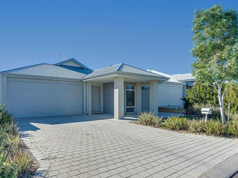 This beautifully presented home offers a blend of modern comfort and coastal living.