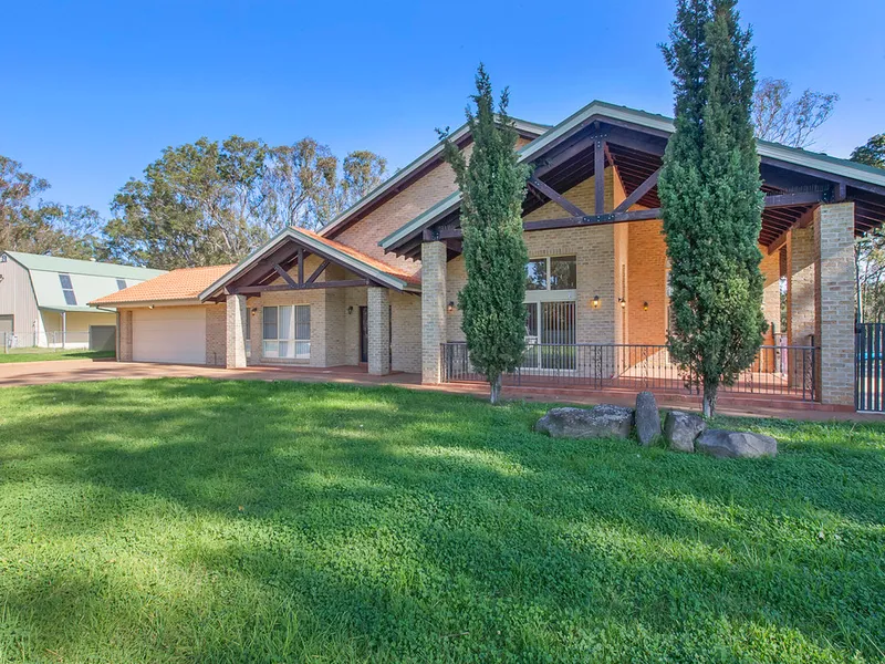 An elegant acreage hideaway!