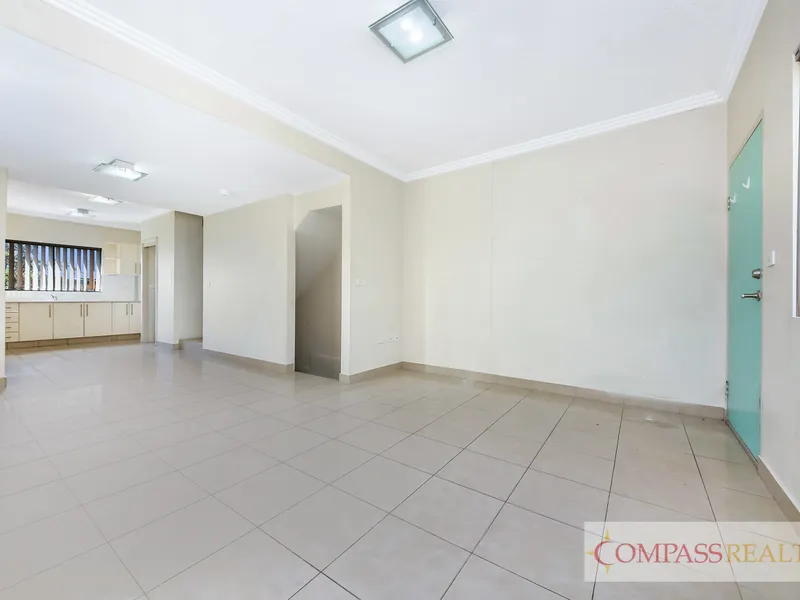 TRENDY TRI-LEVEL TOWNHOUSE