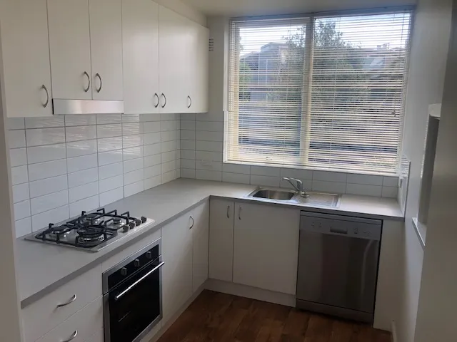Renovated kitchen and bathroom in 1960s block, close to shops and transport