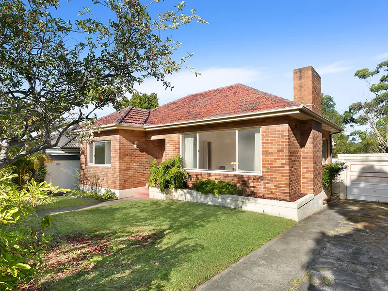 Original brick home nestled in a peaceful neighborhood.