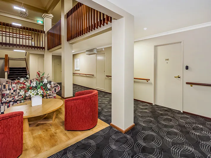 Enjoy elevated views of the village gardens from this high set, well-presented apartment