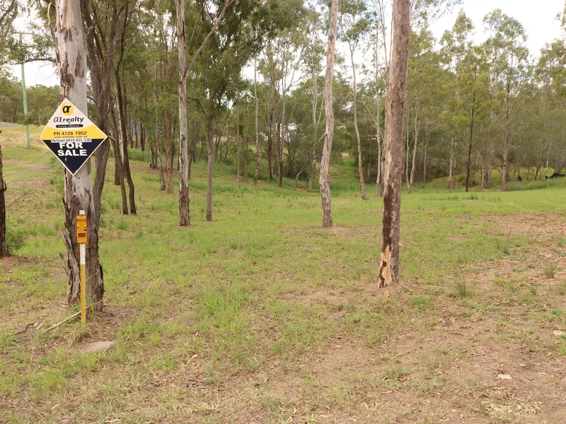 TIDY 1/2 ACRE CORNER BLOCK IN APPLE TREE CREEK!