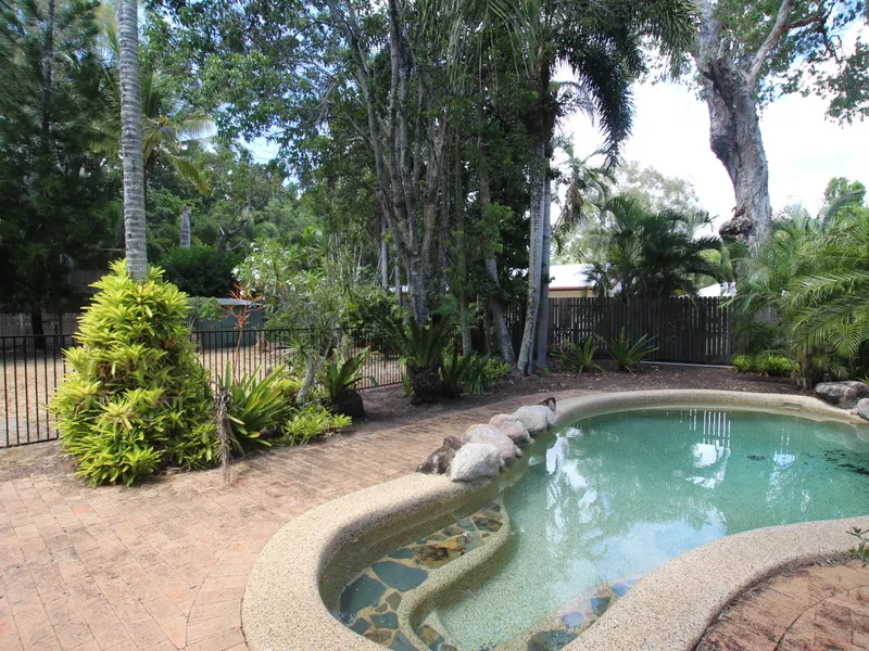 Delightful sun-drenched family home with sparkling lagoon pool and large back yard!