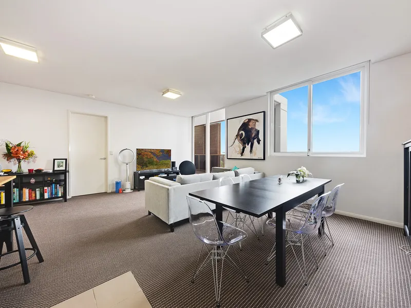 Stylish Two-Bedroom Apartment with Tree-line and District Views
