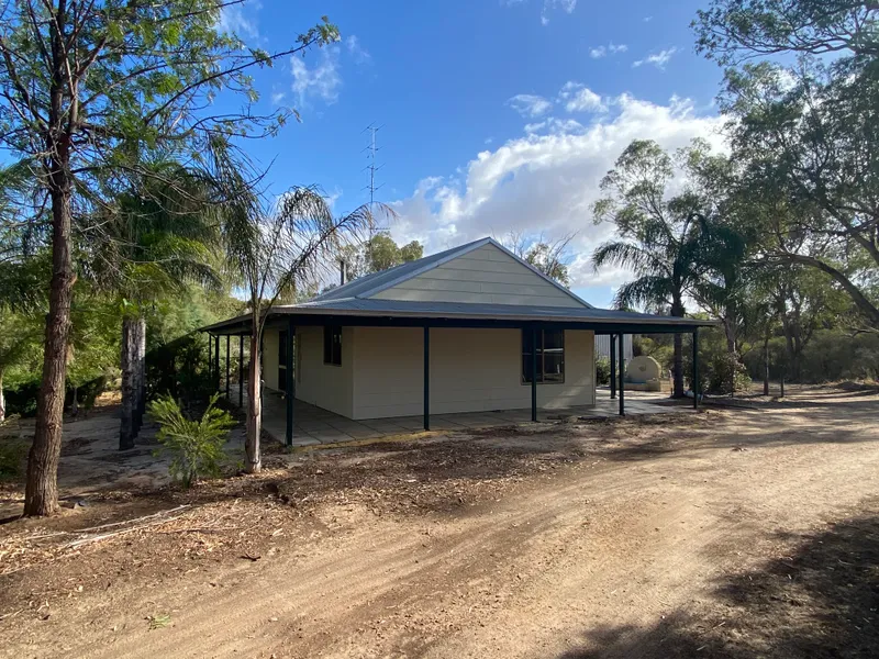 Riverfront cottage with large workshop on 1 acre for under $300,000. WOW