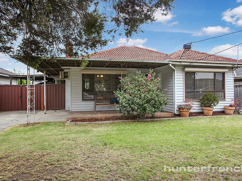 FAMILY HOME ON SPACIOUS PARCEL OF LAND.