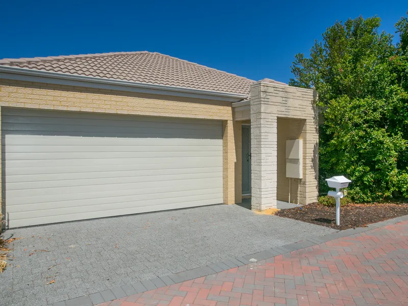 Modern Home with Double Car Garage and Large Windows