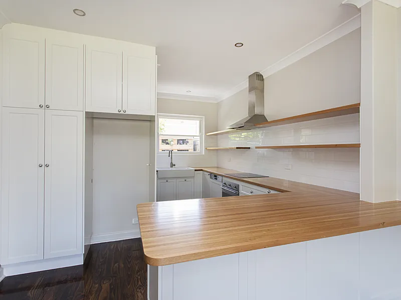 Beautifully renovated low maintenance unit with street frontage