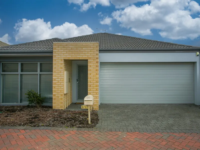 Modern Home with Double Car Garage and Large Windows