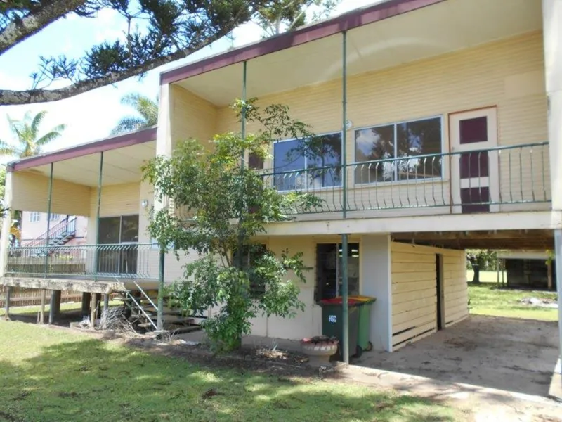 SPLIT LEVEL DOER-UPPER ON LARGE BLOCK IN TOWN !