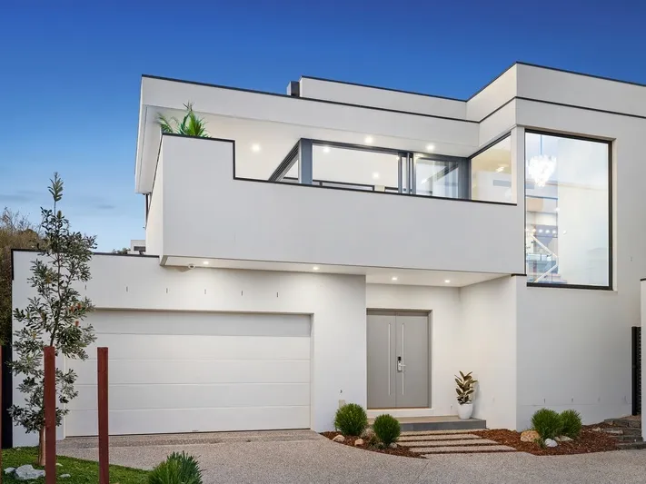 Luxurious beachside oasis with easy-care allure, featuring stunning bay views