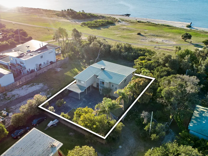 Incredible location with backyard access to beach