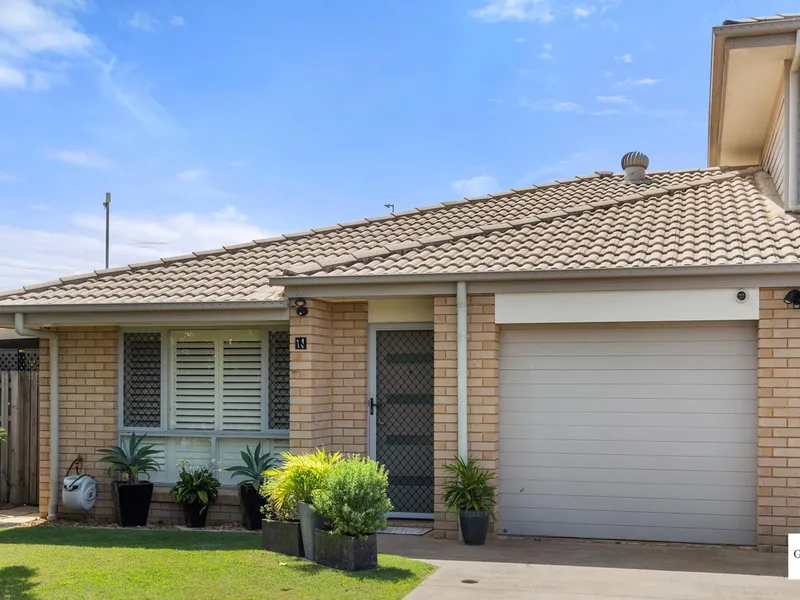 Beautifully presented low set town house with solar in a gated complex with pool!