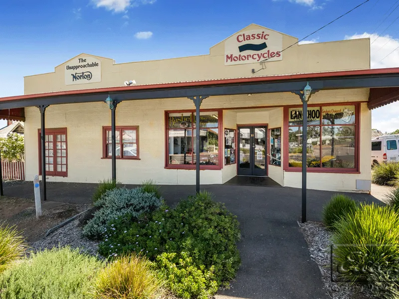 Shop & Home on a Big Block in the Main Street of a Riverside Town