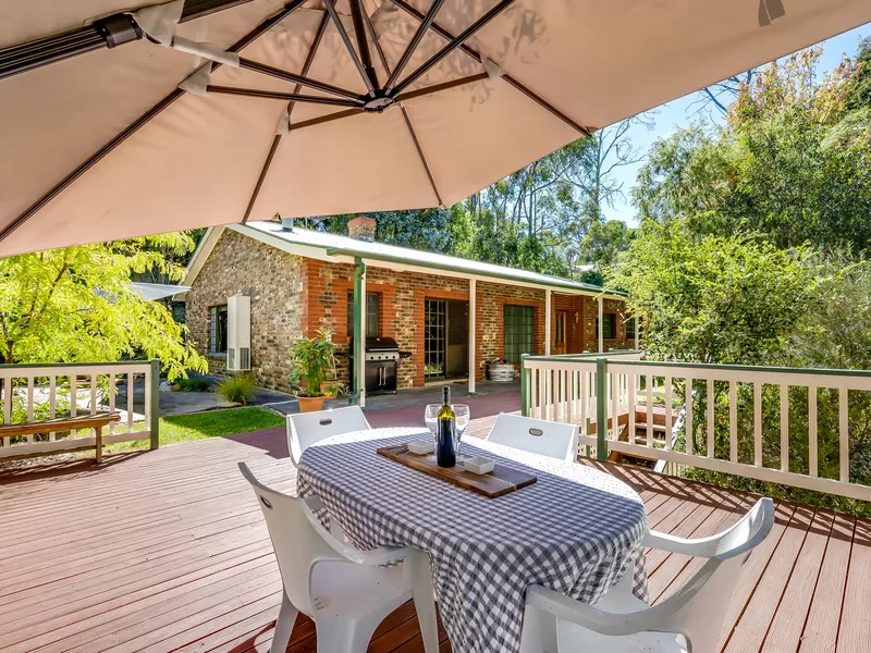Embrace the magic of a Hills hideaway with rustic charm and boundless privacy... 