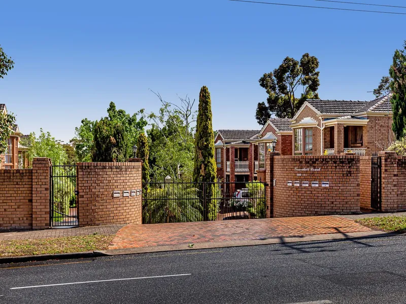 Superbly located, solid brick home; five main rooms and garaging. 