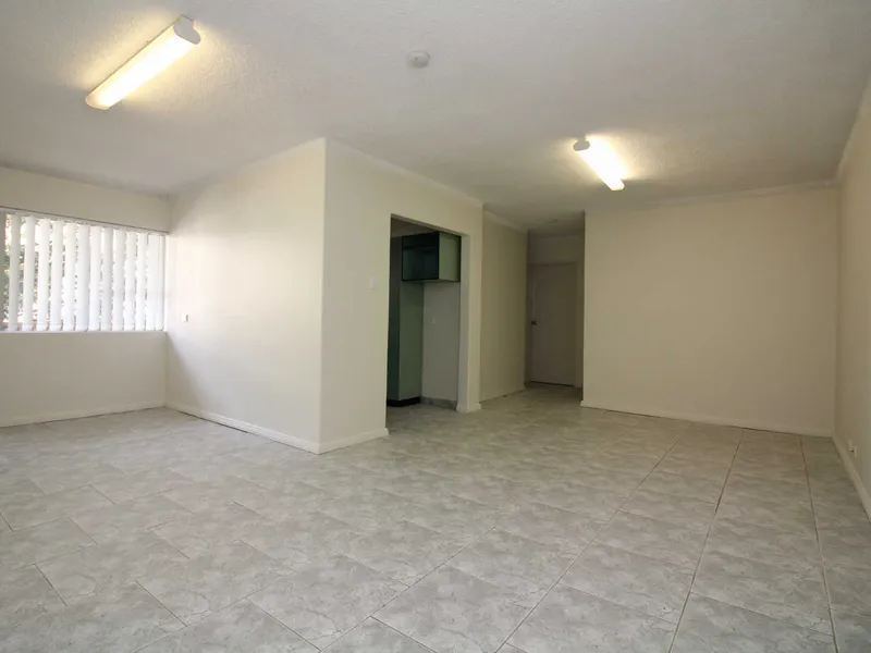 2 BEDROOM UNIT WITH TILED FLOORS TO LIVING AREA!