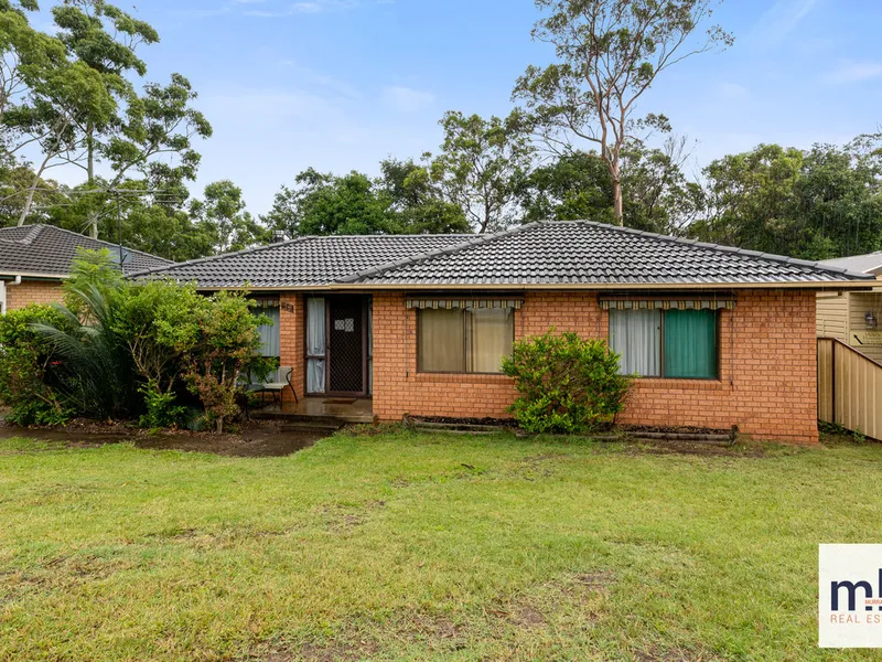 So much potential! Great big yard in a great location!