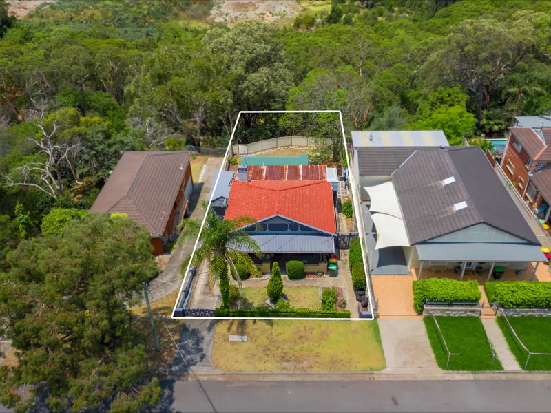 Solid Brick Home Located in Premier Bayside Location with Development Opportunities