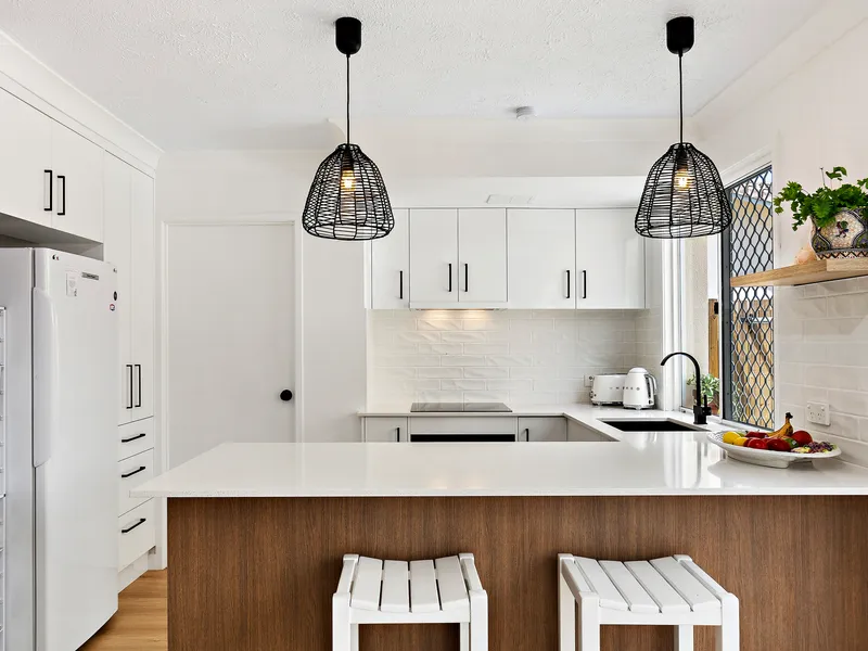 Revamped chic oasis in beach club style complex