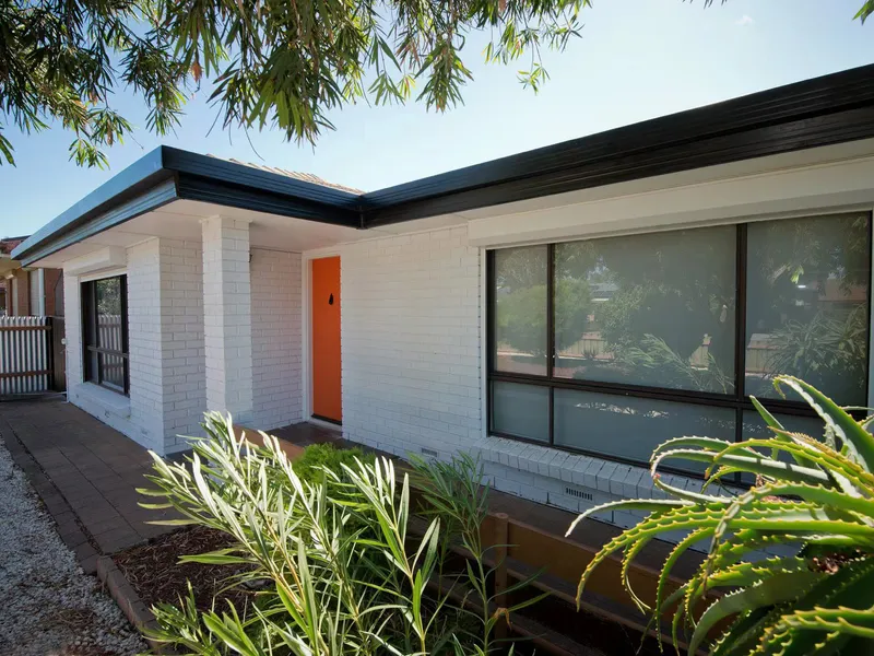 TASTEFULLY UPDATED FAMILY HOME IN GREAT LOCATION OFFERING MINIMAL MAINTENANCE GARDENS!