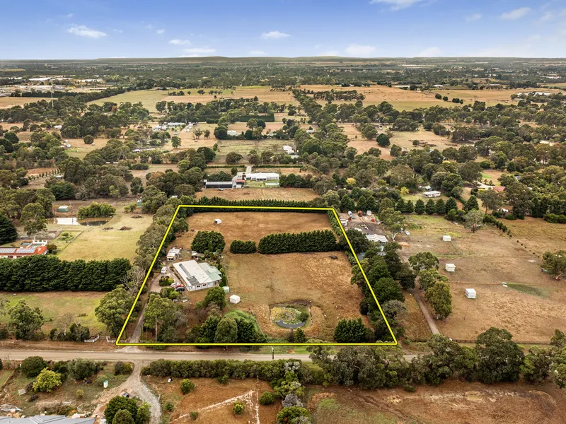 GRAND LIVING WITH 7 BEDROOMS ON 5 ACRES... AND THERE'S AN INDOOR POOL!
