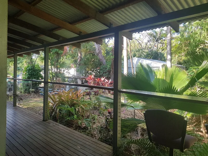 Charming Steel & Timber Home near a tropical creek 1/2 acre block.