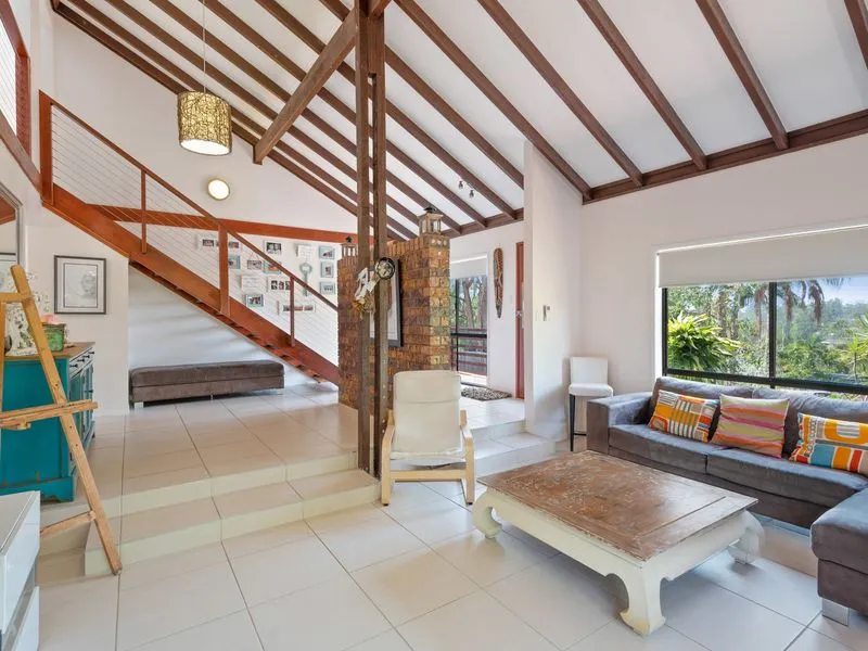 Breezy, High-Set, Split-Level Home with Resort-Style Pool, Solar and Choice of Living Spaces!