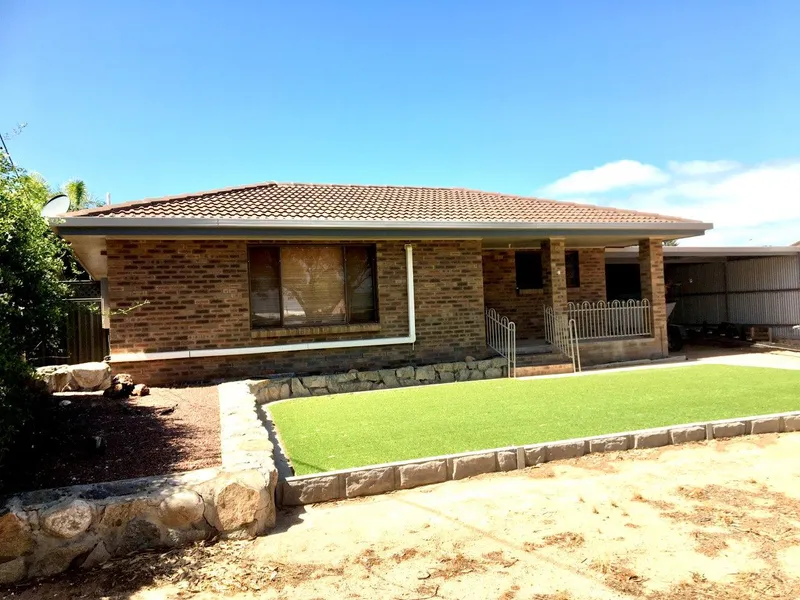Brick veneer home with maintenance free garden