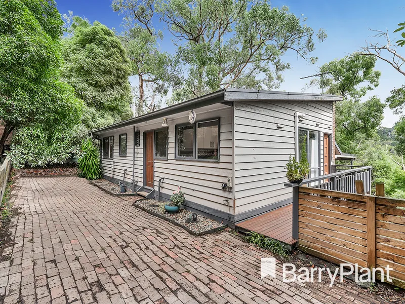 Charming split-level with tranquil views.