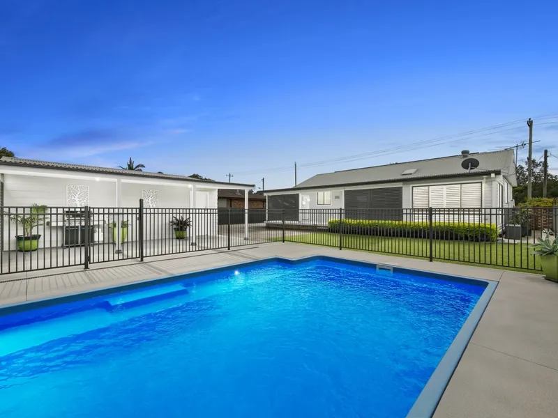 Immaculately presented home with sparkling in-ground swimming pool and garaging