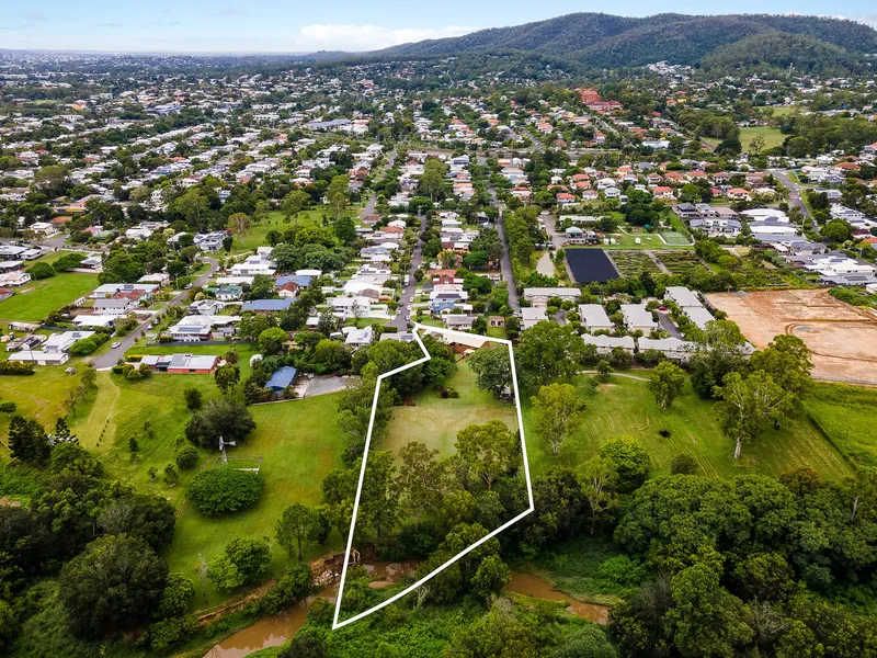 Serene urban oasis on nearly two acres of park-like grounds