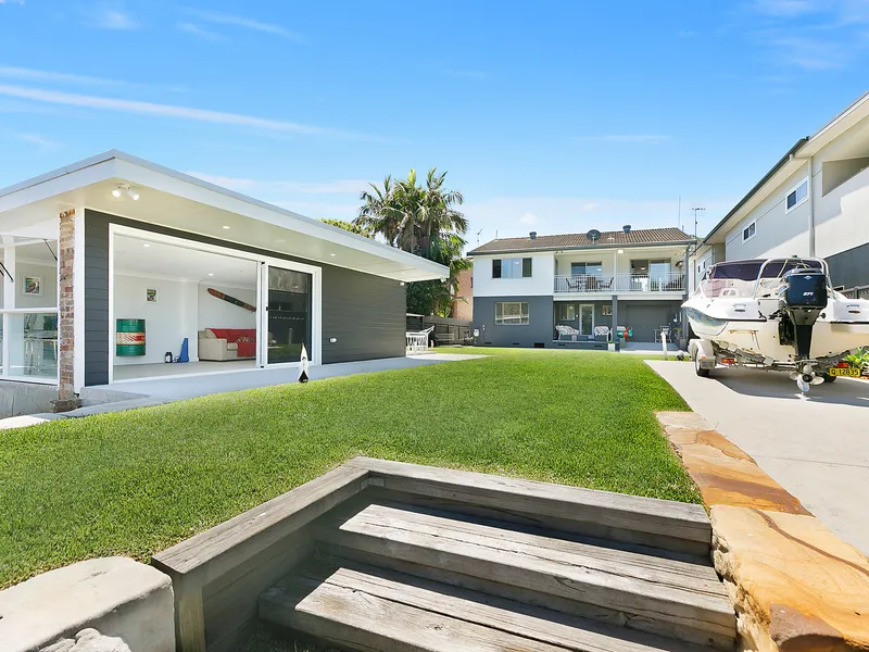 Superb waterfront home boasts versatile living spaces and spectacular views, perfect for those seeking a permanent holiday lifestyle