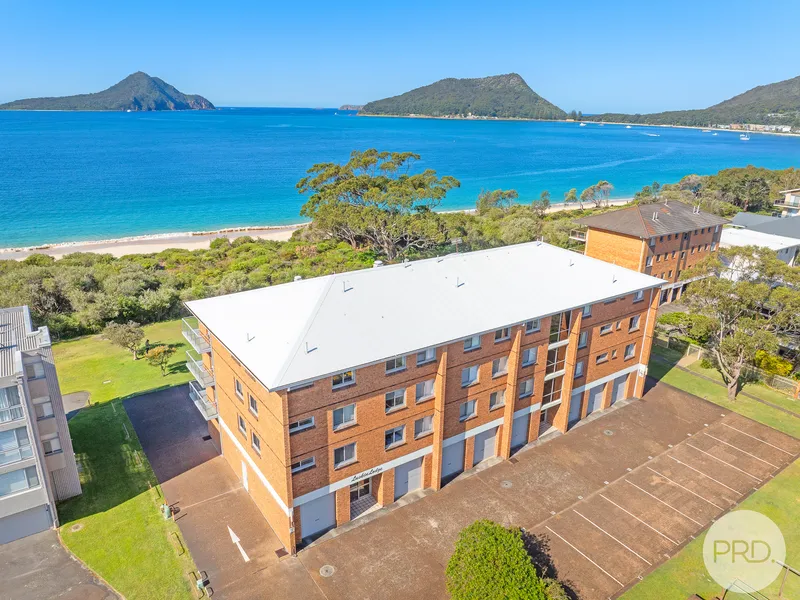 Immaculate Coastal Apartment with Breathtaking Water Views in Prime Shoal Bay Location