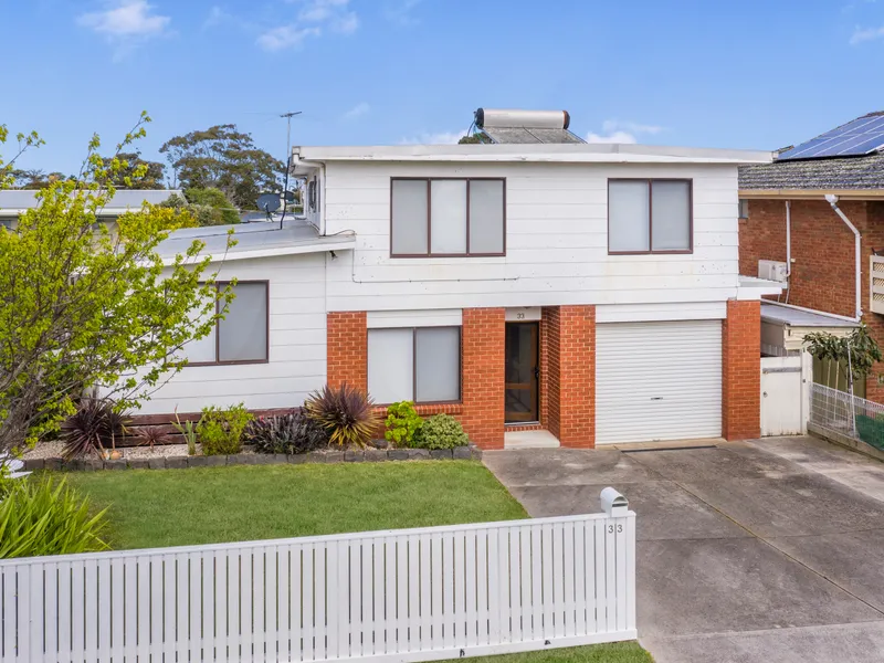 TRI LEVEL COASTAL LIVING WITH WATER VIEWS!